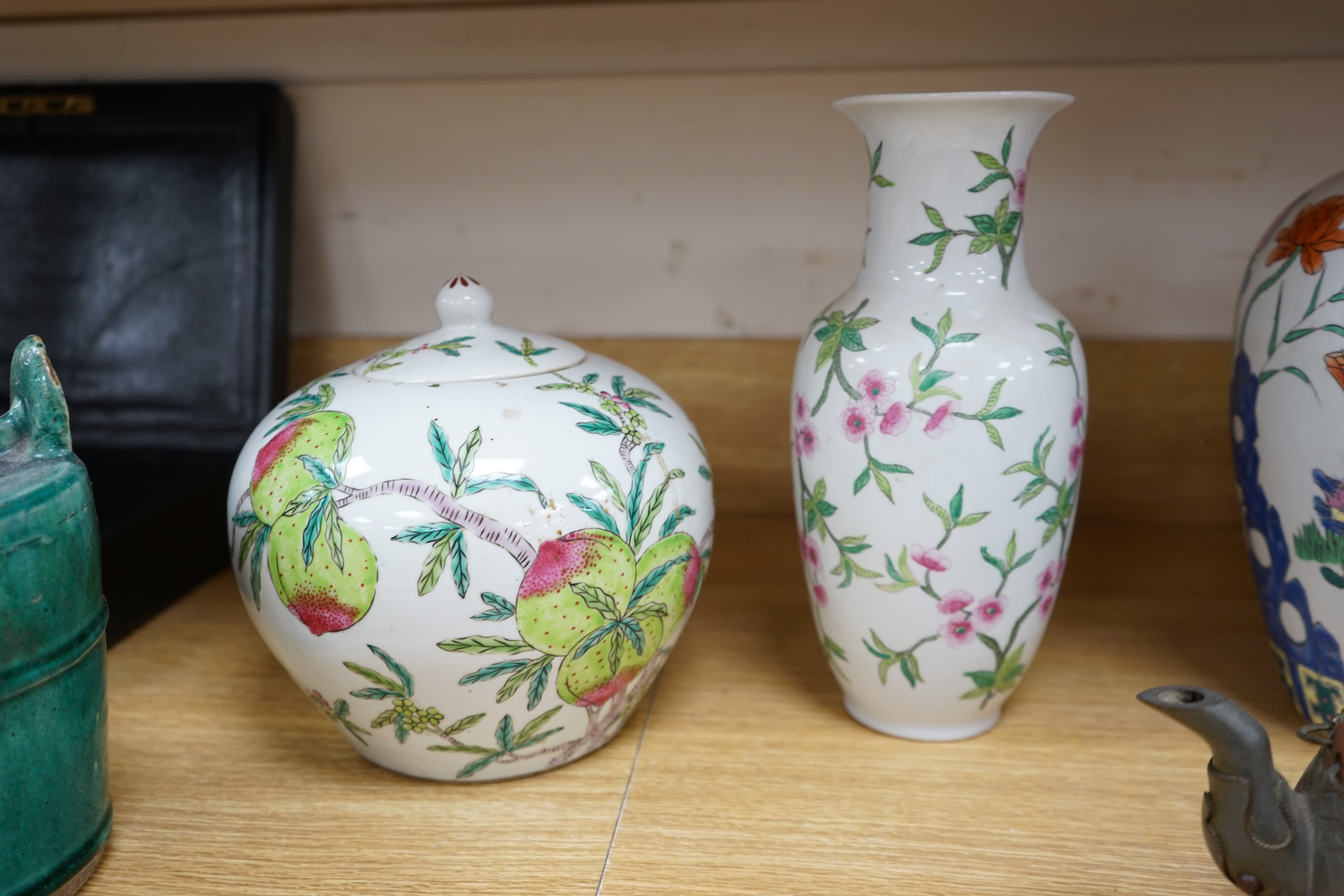 A collection of Chinese ceramics to include and bowls, plates, pottery dragon teapot and a green glaze water carrier, largest 31cm high. Condition - mostly fair